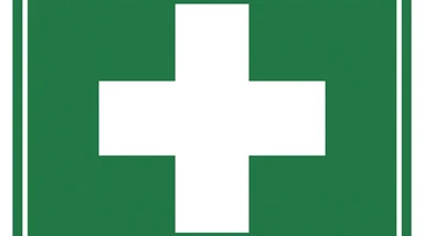 First aid sign with white cross on green background